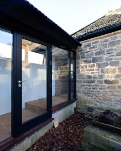 Modern extension meets 19th C stone cottage. Gasworks Cottage by Chris Dyson Architects. Photography: Peter Landers
