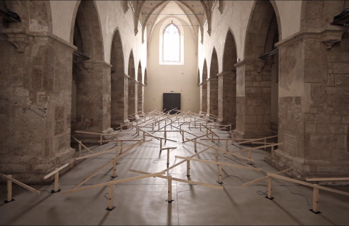 Sound artist Zimoun installs a seesaw orchestra in a gothic church