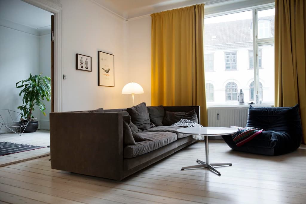 The living room is dominated by a large Cocoon Sofa by Eilersen and Bjorke's favourite Togu Chair by Michel Ducaroy. Photography: Anne Mie Dreves