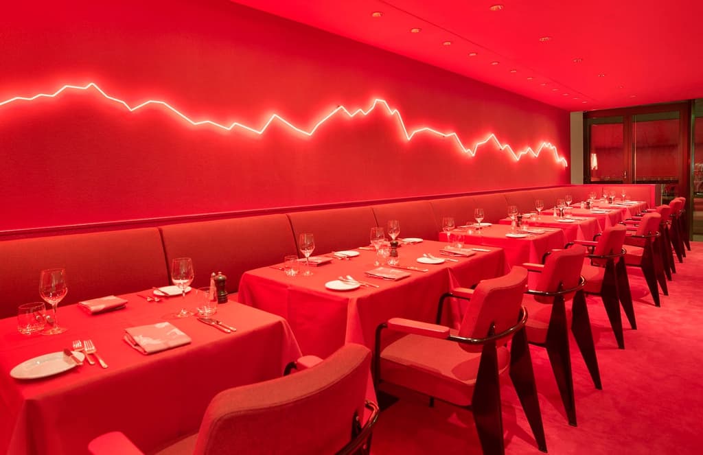 Rolf Sachs mixes neon and red hot hues inside Zurich restaurant Saltz