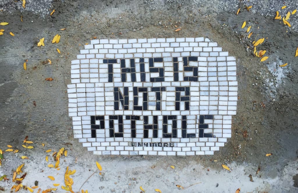 slogan---pothole-mosaic-by-Jim-Bachor