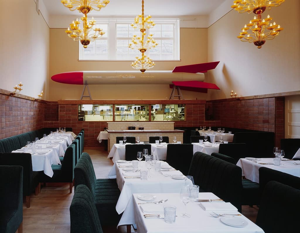 Pauly Saal takes over a former Jewish girls' school. Vestiges of its past can be seen via gymnasium flooring, historic brown tiling and loft ceilings strung with vintage chandeliers