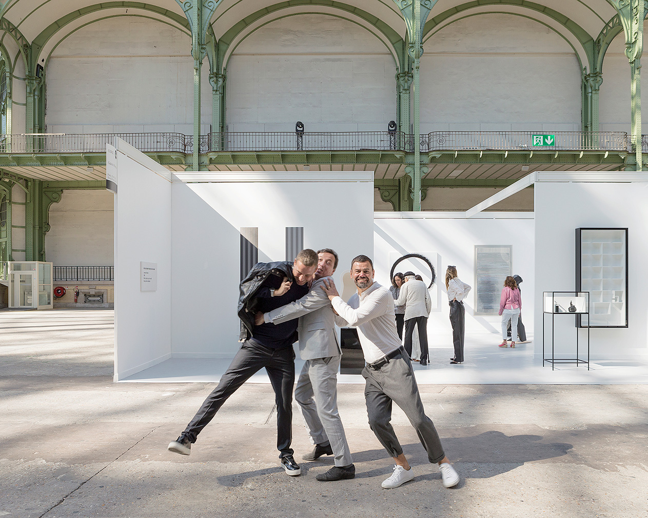 Elmgreen & Dragset with Emmanuel Perrotin in front of of the one-day installation "Elmgreen & Dragset present Galerie Perrotin at the Grand Palais"