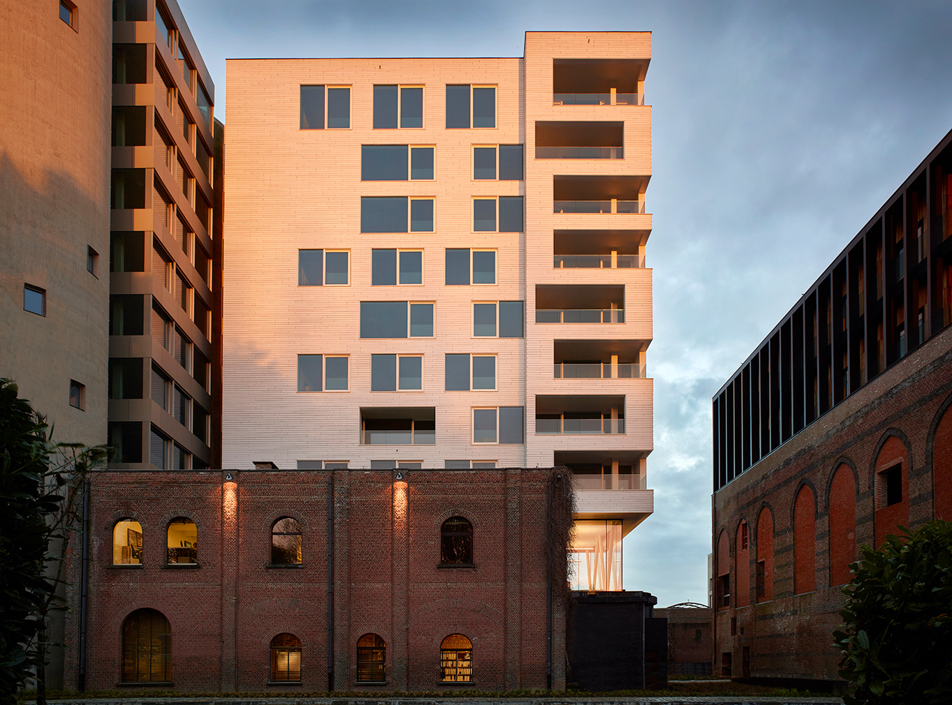 White silo apartments, part of Axel Vervoordt's Kanaal project in Antwerp