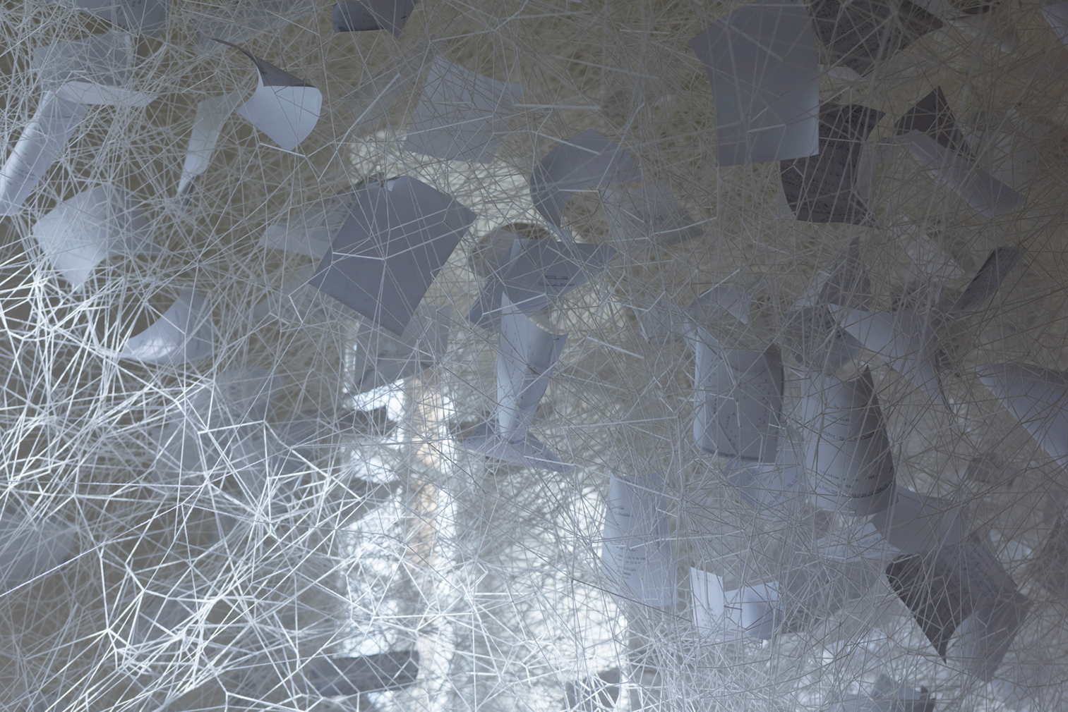 Chiharu Shiota, Beyond Time, 2018. White thread, metal piano, musical notes. (c) VG Bild- Kunst, Bonn, 2018 and the artist. Courtesy Yorkshire Sculpture Park. Photography: Jonty Wilde