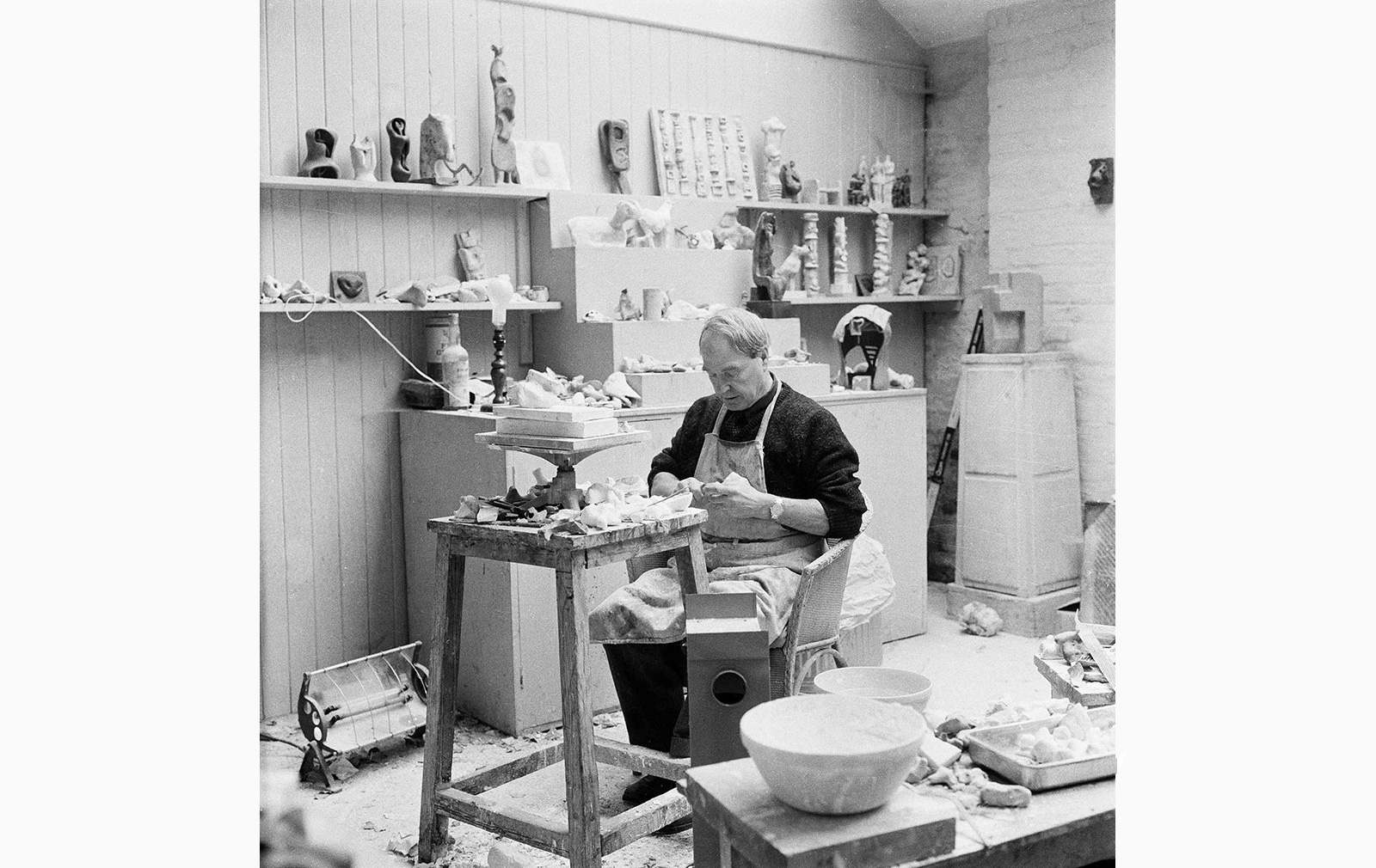 Henry Moore working on a plaster in his Maquette Studio, Perry Green, c. 1960. Photography: John Hedgecoe. Reproduced by permission of The Henry Moore Foundation for the Wunderkammer: Origins of Form exhibition at Gagosian