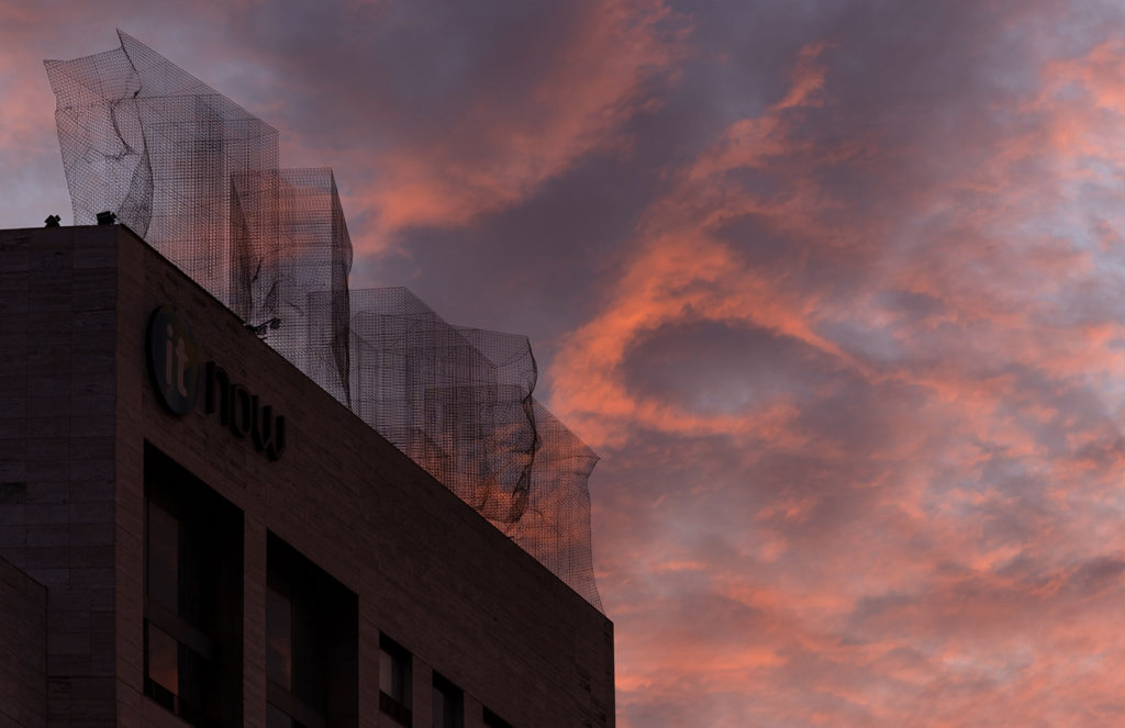 Giant faces watch over Barcelona in Edoardo Trisoldi’s latest installation