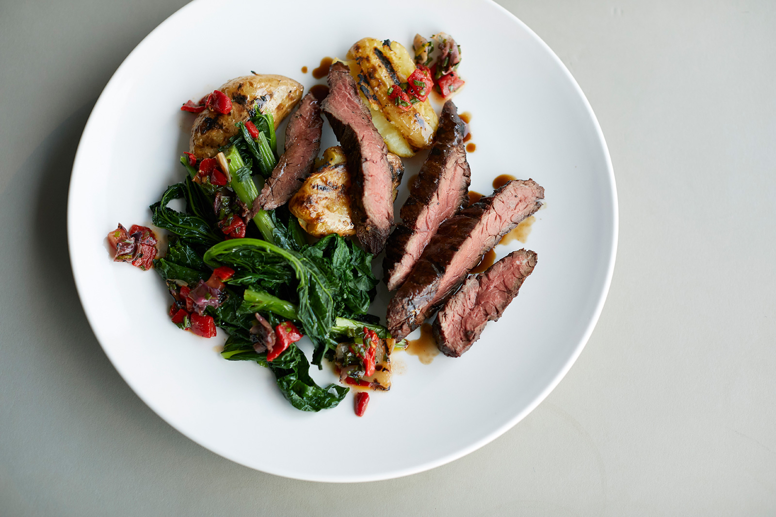 Lamb rump with celeriac, almonds, skordalia and braised chard. Photography: Lucy Richards
