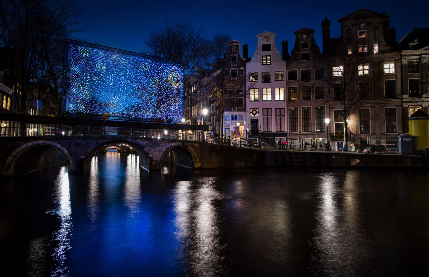 Van Gogh’s Starry Night illuminates an Amsterdam bridge