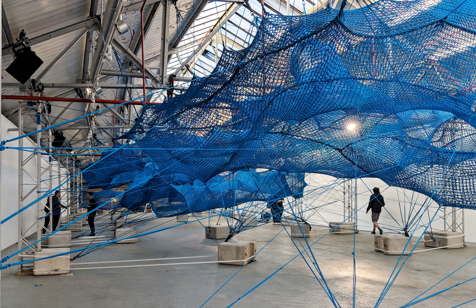 Arts collective Numen/For Use weaves a giant net inside London’s Brewer Street Car Park