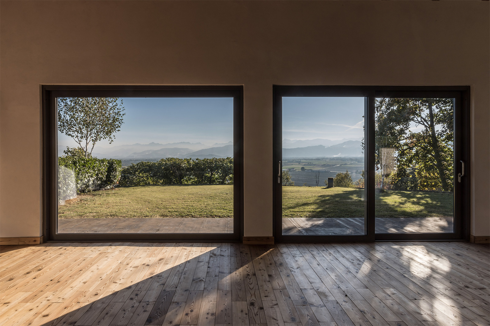 Villa con Vista: a simple interior palette of white walls and raw timber floors doesn't detract from the views