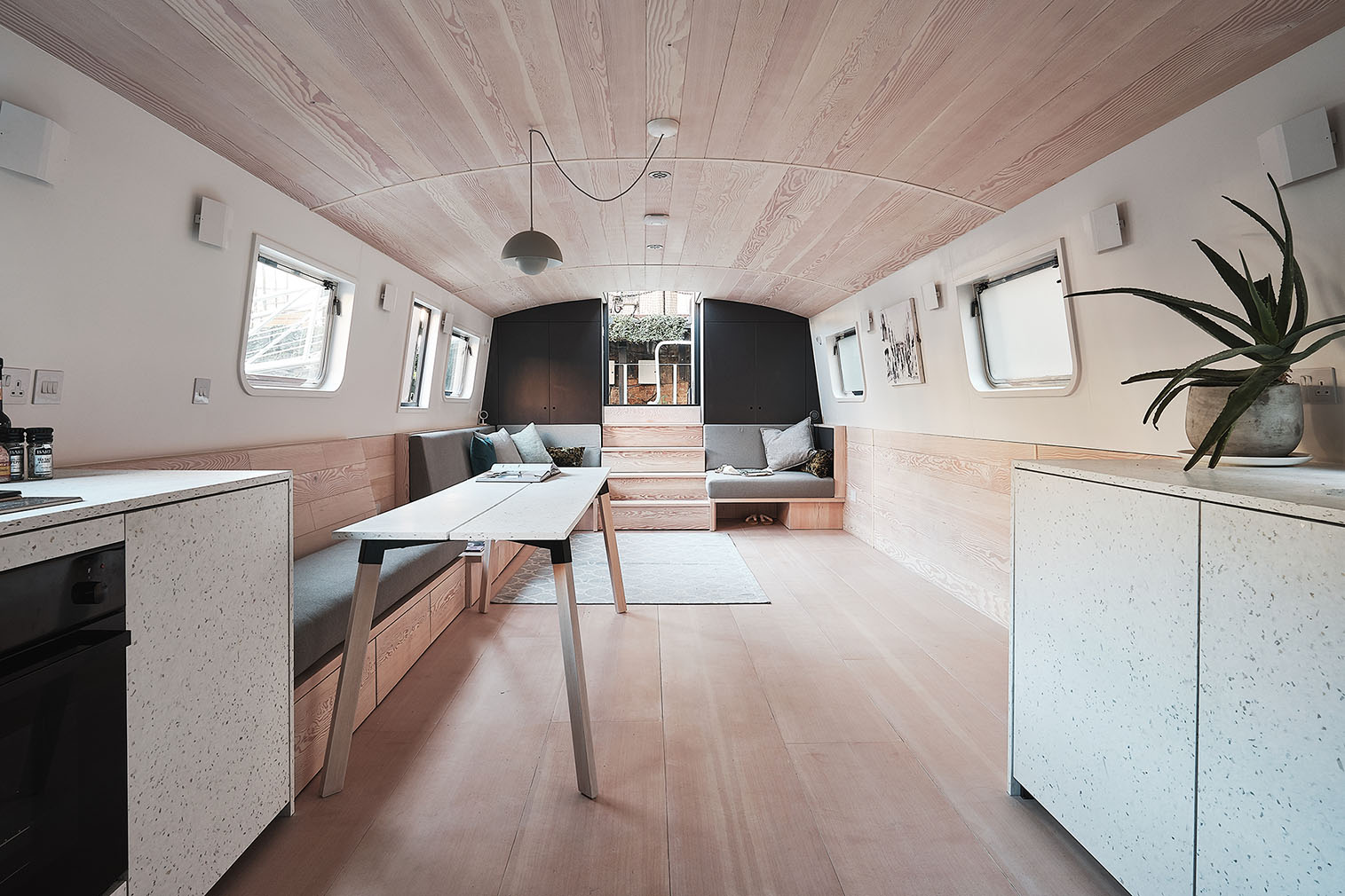 Interiors of The Dusky Parakeet house boat designed by 31/44 Architects. It's for sale via Aucoot