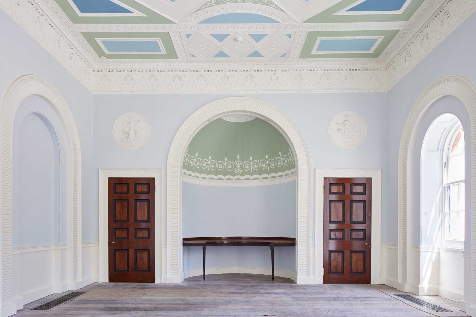 A reception room inside London’s Pitzhanger Manor, which features bold colours and neo-classical symmetry 