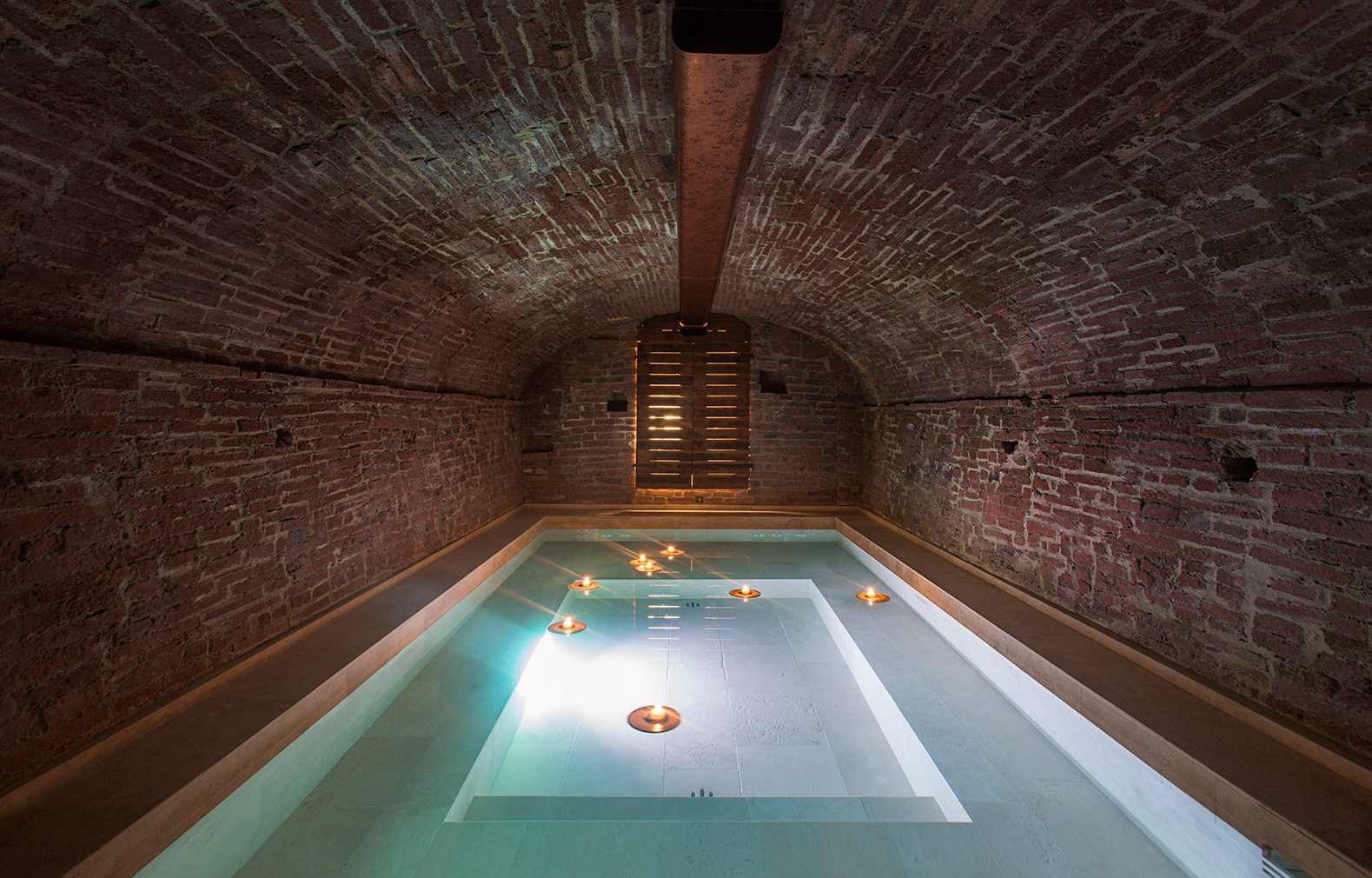 A plunge pool is hidden in a vaulted cellar beneath the loft