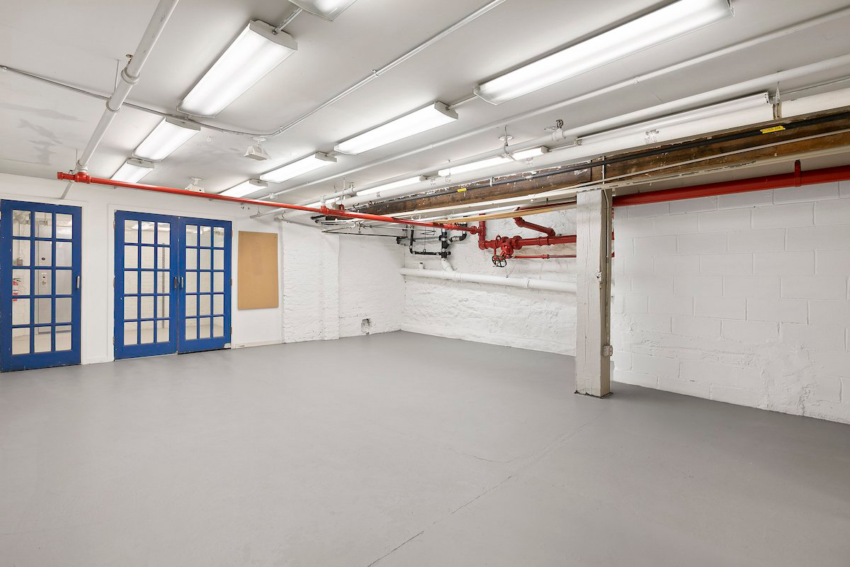 A 1,350 sq ft basement space, which could potentially be used as a gym, studio, or office.