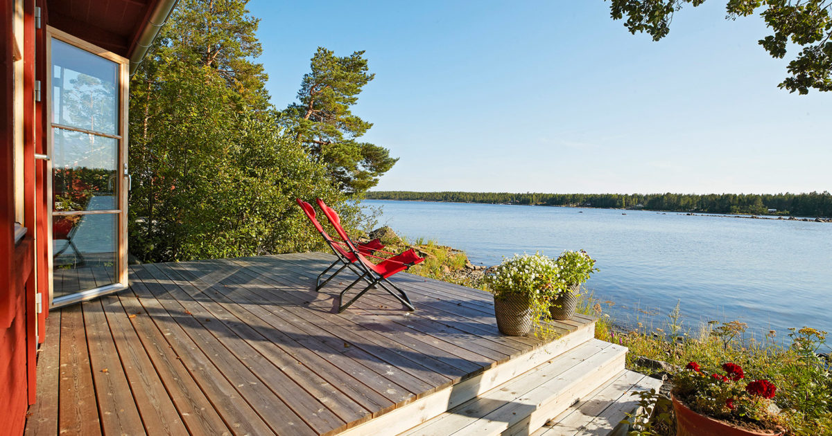 A private Swedish island with striking red cabin home could be yours