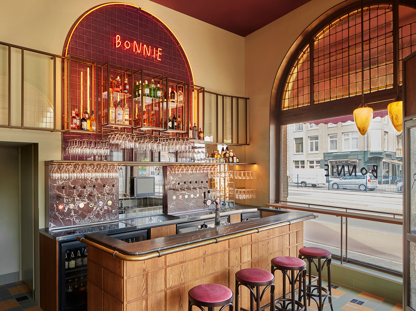Burgundy tones and tiles set the scene at Amsterdam bistro Bonnie