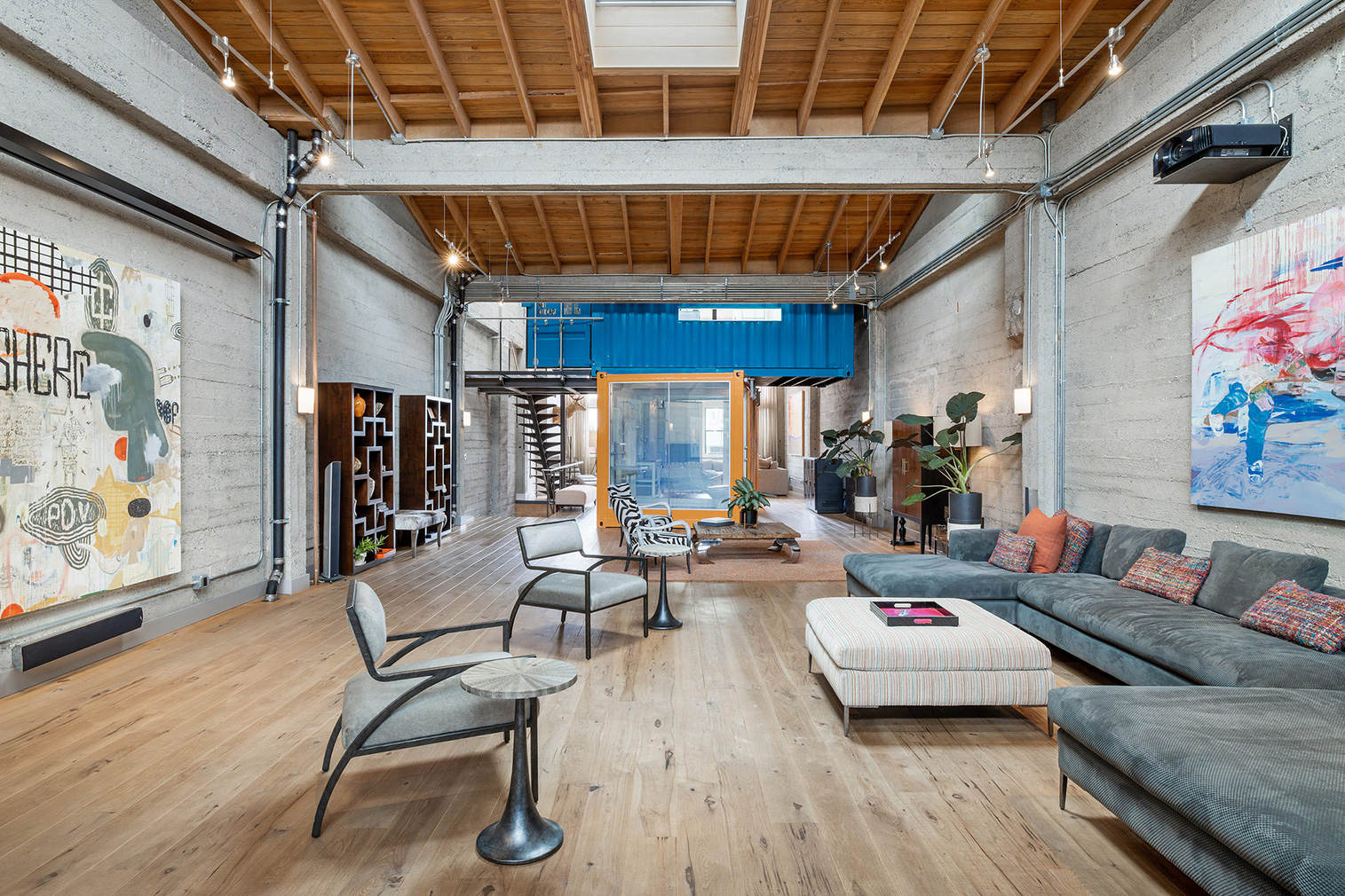 Stacked shipping containers sit inside this sprawling warehouse loft in San Francisco's Fillmore District, juxtaposing industrial brick bones with rugged steel.