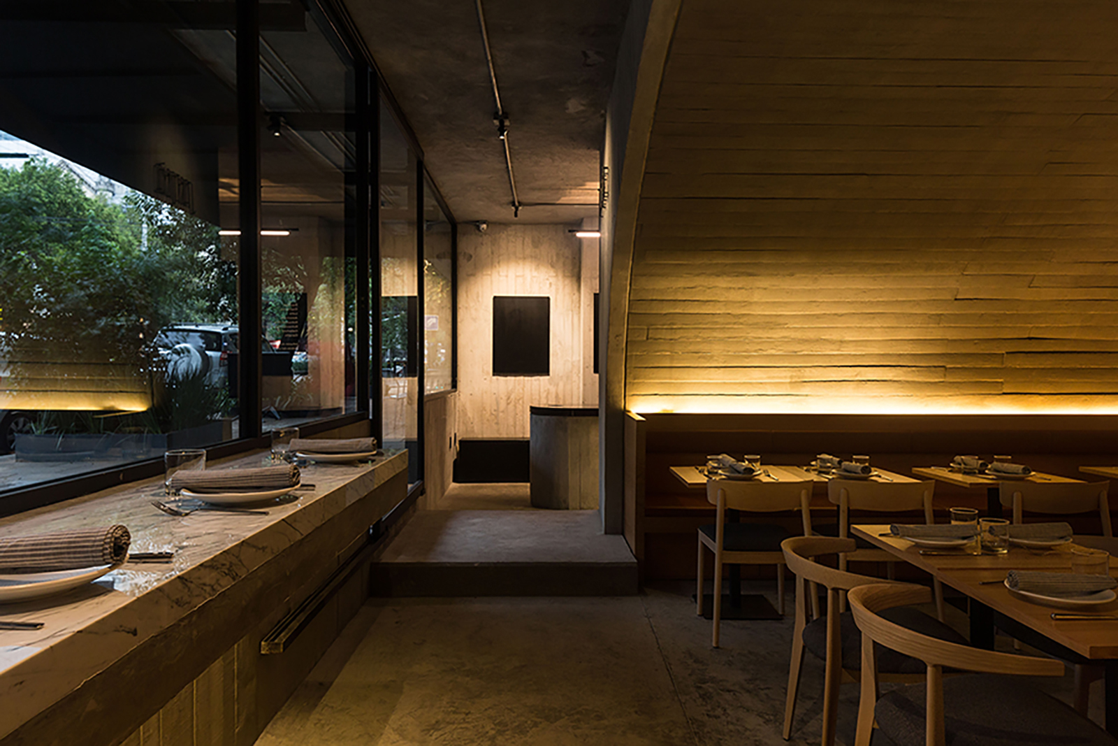 Sartoria offers a contemporary take on Europe's vaulted taverns, serving fresh pasta inside a glowing concrete tunnel in Mexico City's Roma Norte neighbourhood.