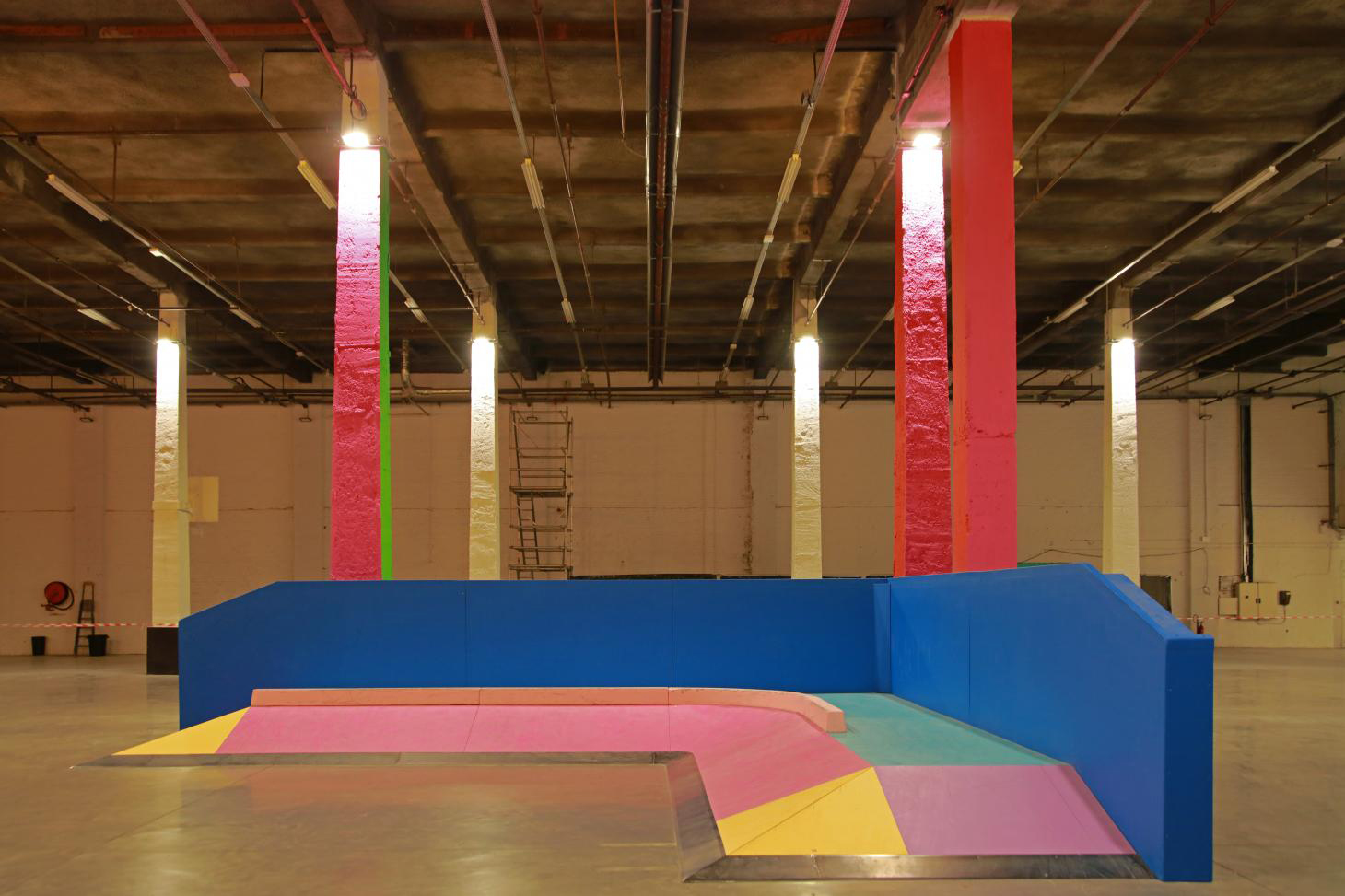 Golden columns and fluorescent paint helped Yinka Ilori turn Roubaix’s Halle B warehouse into the Colorama Skatepark.