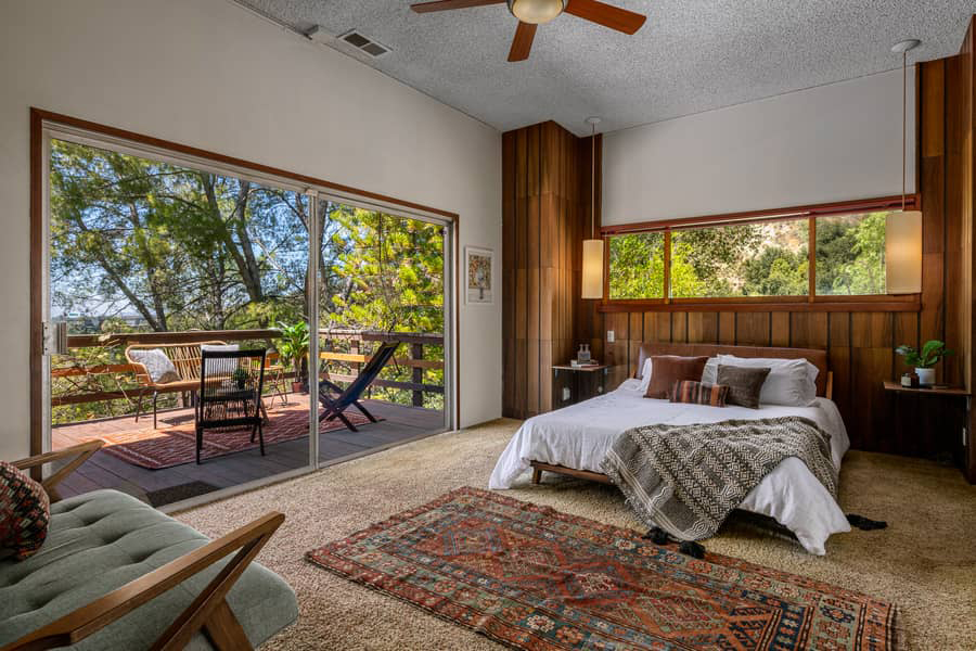 The master bedroom opens onto a large private terrace overlooking the canyon