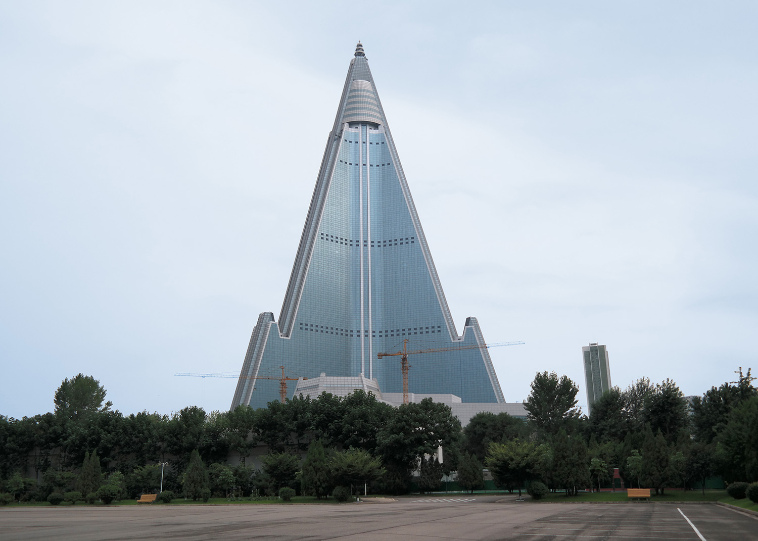 Ryugyong Hotel, aka The Hotel of Doom. Its construction began in 1987 – it is still incomplete 33 years later