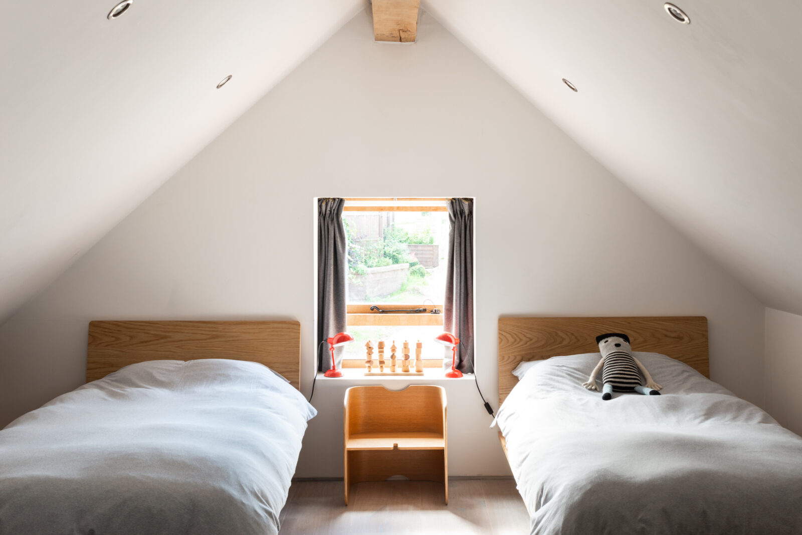 Gabled ceilings and thick oak beams add character in the bedrooms.