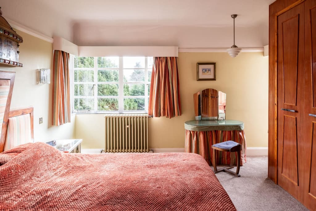 One of the bedrooms with original fixures